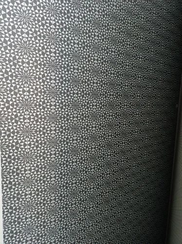 Designer panel with a repeating geometric perforated pattern